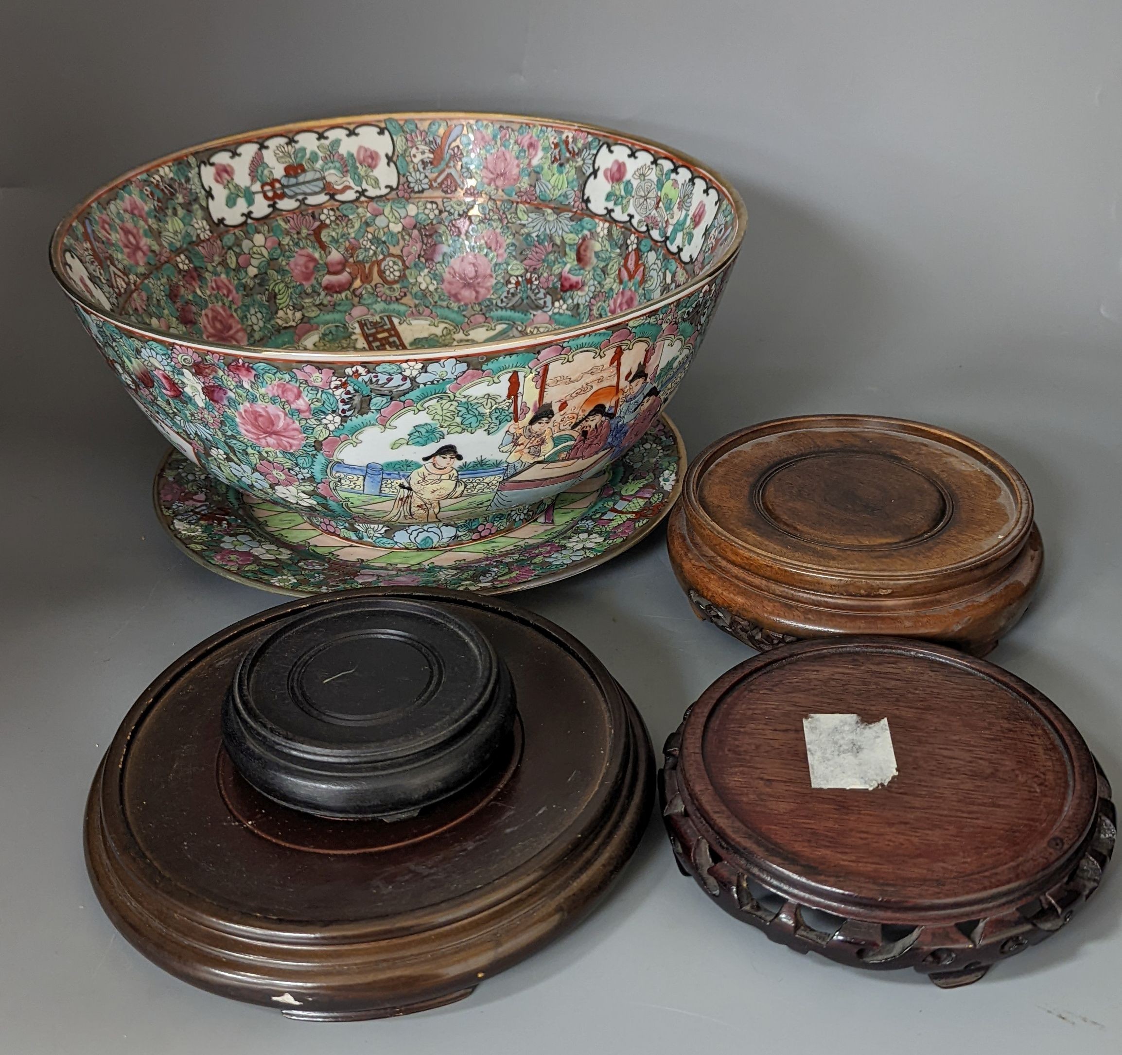 A Chinese famille rose bowl, plate and four stands, bowl 31 cms diameter.